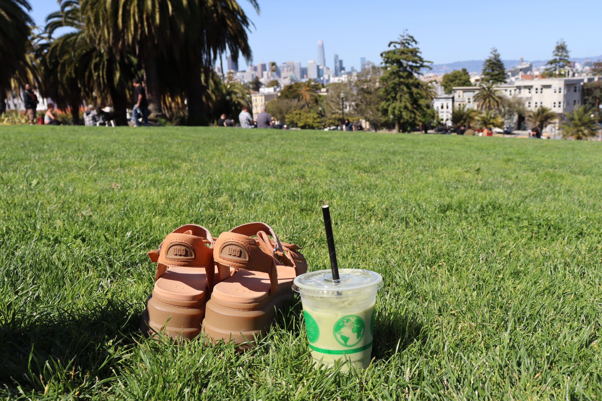 Shoes off and matcha latte in the grass at the Dolores Park in san Francisco.